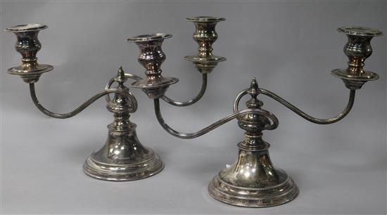 A pair of two branch two light dwarf silver candelabra, by Viners Ltd, Sheffield, 1961, height 20cm.